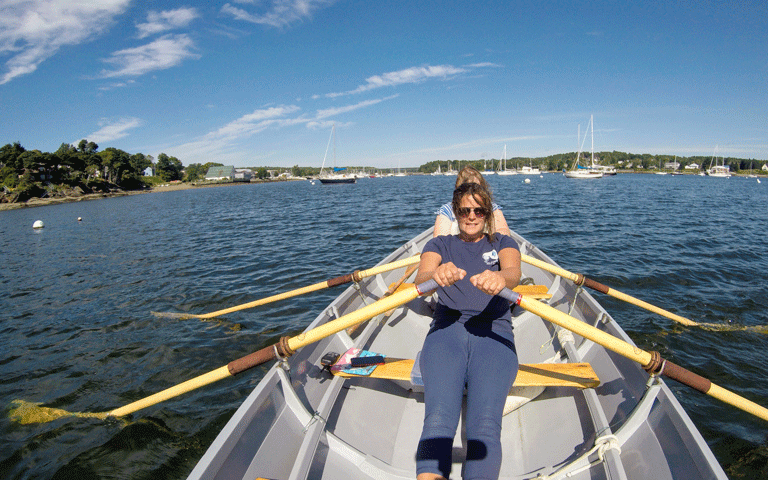 Nicolle Littrell operates Dory Woman Rowing in Belfast Harbor year-round. Here, she rows with a client on the harbor in September. PHOTO: COURTESY NICOLLE LITTRELL
