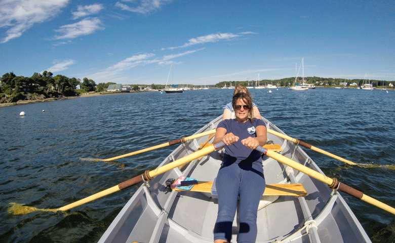 Nicolle Littrell operates Dory Woman Rowing in Belfast Harbor year-round. Here, she rows with a client on the harbor in September. PHOTO: COURTESY NICOLLE LITTRELL