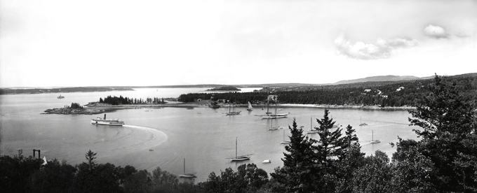 A panoramic image of Seal Harbor, made in August 1910. The photograph was taken from Graycliff, the Eugene Stuart Bristol Cottage. The steamship Norumbega leaves the steamboat wharf and heads out of Seal Harbor Harbor. The steamship Sappho sits just outside the harbor. PHOTO: COURTESY SOUTHWEST HARBOR PUBLIC LIBRARY
