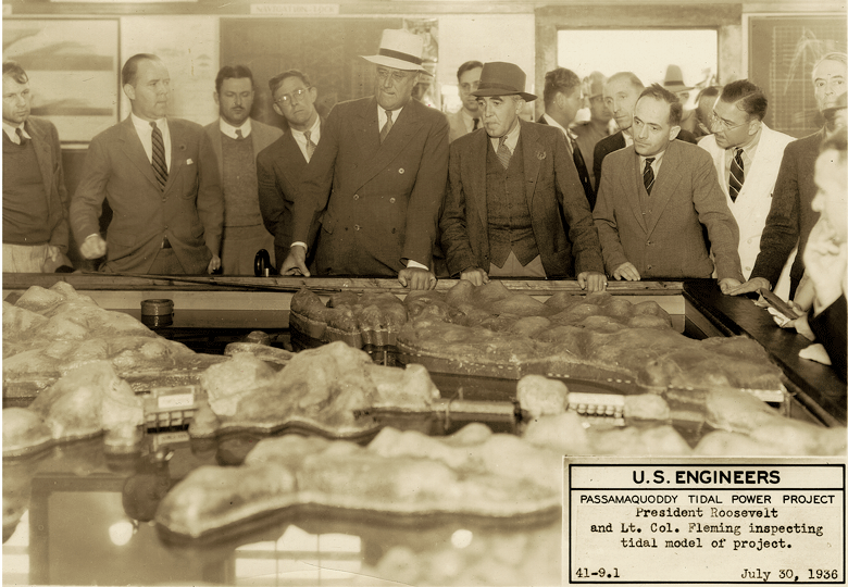 Eastport was the intended site of the Passamaquoddy Tidal Power Project, the first attempt by the federal government to fund an energy generating dam fueled by the tides. It was a project thoroughly supported by President Franklin Roosevelt, seen here examining a model still viewable in Eastport today. The project was terminated after Congress didn't support further funding, but its influence—including a push to provide housing for 5,000 workers that led to the building of Quoddy Village—left lasting impacts on the port city.