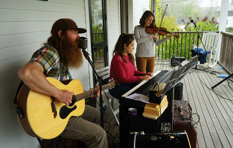 rom left, Tom Stevens, Natasha Stevens, and Anne McKee, who sometimes perform as the Dark Harbor Trio. They played during the Islesboro Energy Jamboree on Saturday, May 21.