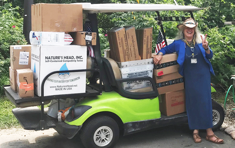 Joy Sprague in the golf cart she uses to pick up mail. PHOTO: COURTESY BARBARA FERNALD