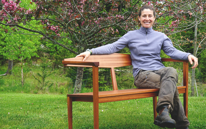Christina Vincent poses on one of her benches. PHOTO: TOM GROENING