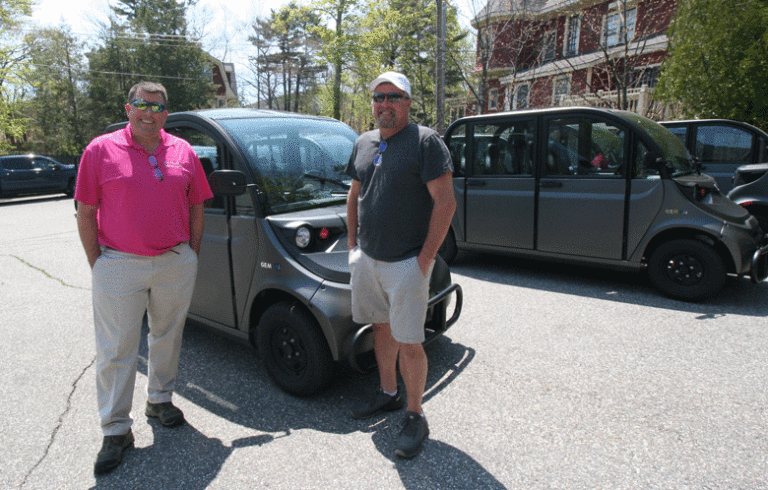 Eben Salvatore, left, and Jeff Young, who are introducing the electric vehicles to Acadia and Bar Harbor. PHOTO: LAURIE SCHREIBER