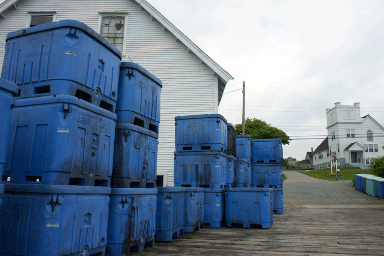 Bait bins sit on a pier in Cutler. FILE PHOTO: TOM GROENING
