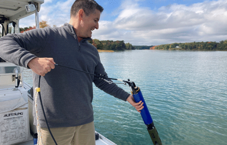 Staff scientist Mike Doan collects water quality data from Friends’ research vessel, R/V Joseph E. Payne using a data sonde, a device that measures temperature, salinity, dissolved oxygen, and other parameters.
