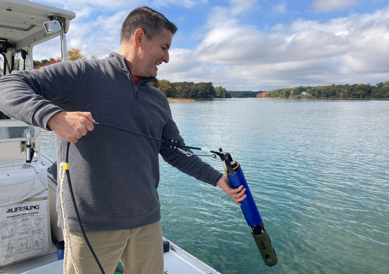 Staff scientist Mike Doan collects water quality data from Friends’ research vessel, R/V Joseph E. Payne using a data sonde, a device that measures temperature, salinity, dissolved oxygen, and other parameters.