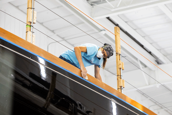 A Lymnan-Morse employee polishes a boat's rail. PHOTO: JACK SULLIVAN
