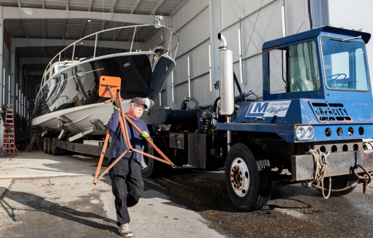 An employee of Lyman-Morse in Thomaston carries a boat stand. PHOTO: JACK SULLIVAN