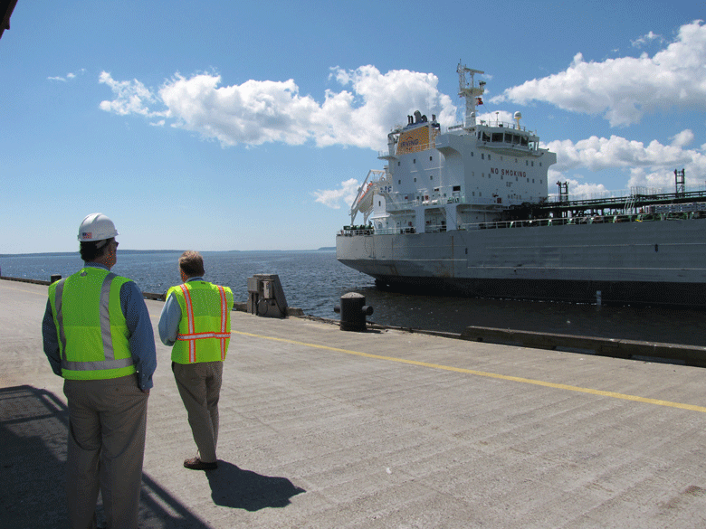Maine Department of Transportation officials watch an Irving ship near the Mack Point terminal in Searsport in 2013. FILE PHOTO: TOM GROENING