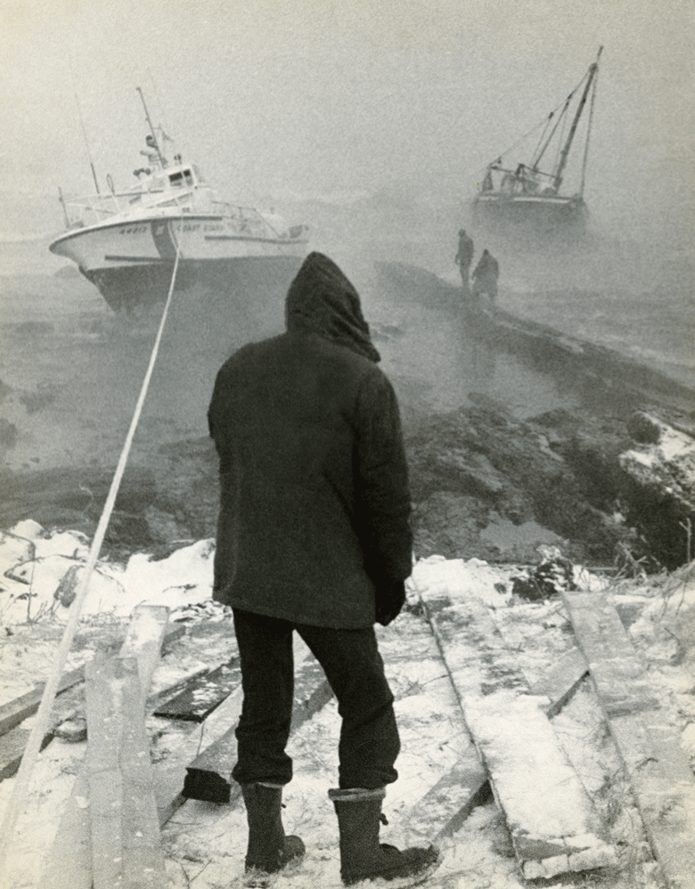 A photo shot in December 1973 shows a fishing boat and Coast Guard vessel in peril at the mouth of Casco Bay. PHOTO: NATIONAL FISHERMAN COLLECTION, PENOBSCOT MARINE MUSEUM