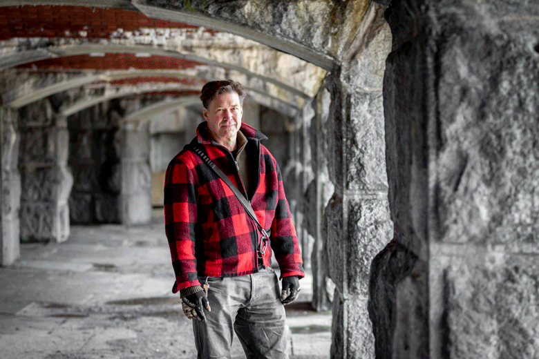 Paul Drinan, executive director of the Friends of Fort Gorges, poses inside the fort in Portland Harbor during a tour.