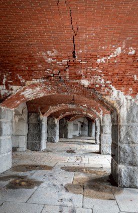 Cracks are visible in the arch.