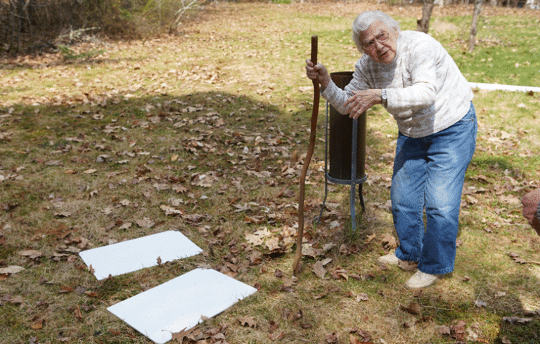 Arlene Cole points to the platforms she uses to measure snowfall.