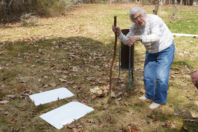 Arlene Cole points to the platforms she uses to measure snowfall.