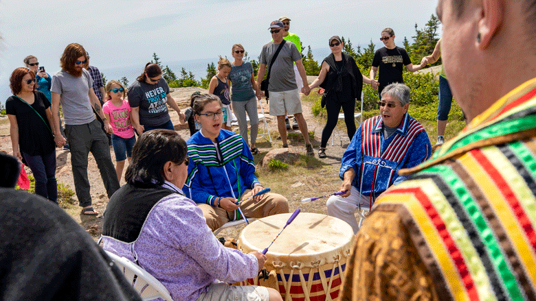 The Burnurwurbskek Singers, a Penobscot male drum group, performs at Cadillac Mountain Summit. PHOTO: COURTESY WILL NEWTON, FRIENDS OF ACADIA