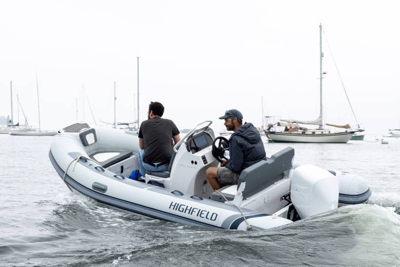 Gabe Pendleton of Pendleton Yacht Yard takes an Island Institute's Alex Kravitz for a spin around Rockland Harbor in a boat powered by a 40-horsepower electric outboard. PHOTO: JACK SULLIVAN