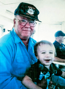 Al Dinsmore, photographed with his grandson, on one of his last ferry runs.