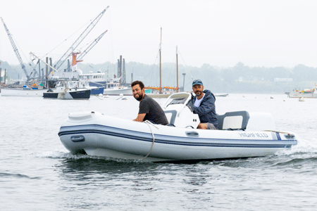 Gabe Pendleton of Pendleton Yacht Yard on Islesboro is at the helm of a boat powered by a 40-horsepower electric outboard. PHOTO: JACK SULLIVAN