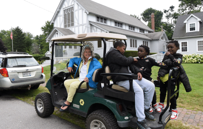 Patty Zimmerman of Peaks Island transports three children from the Mabuie of Mozambique. Several Peaks Island families have taken young people who are recent immigrants from African countries, now living in Portland, into their homes for short- and long-term visits.