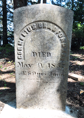 A stone marking Cornelius Bradford’s grave, the base of which has been set in concrete. PHOTO: TOM GROENING