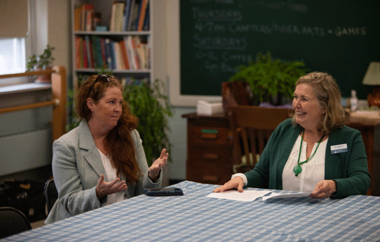 Rhiannon Hampson, left, state director of the U.S. Department of Agriculture, joins Kim Hamilton, Island Institute president at an event announcing the nonprofit being awarded two key grants. PHOTO: JACK SULLIVAN