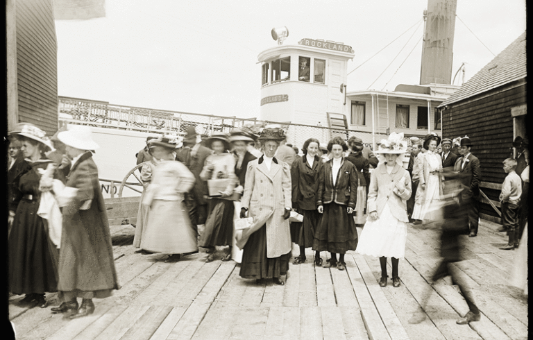 Three young women pose for a photograph at the steamship wharf at Sandy Point in Stockton Springs. PHOTO: COURTESY PENOBSCOT MARINE MUSEUM