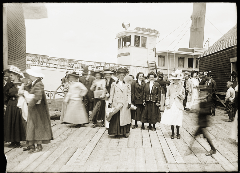 Three young women pose for a photograph at the steamship wharf at Sandy Point in Stockton Springs. PHOTO: COURTESY PENOBSCOT MARINE MUSEUM