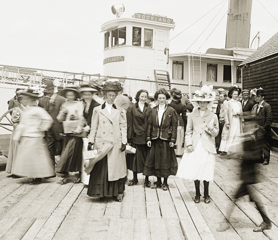 Three young women pose for a photograph at the steamship wharf at Sandy Point in Stockton Springs. PHOTO: COURTESY PENOBSCOT MARINE MUSEUM
