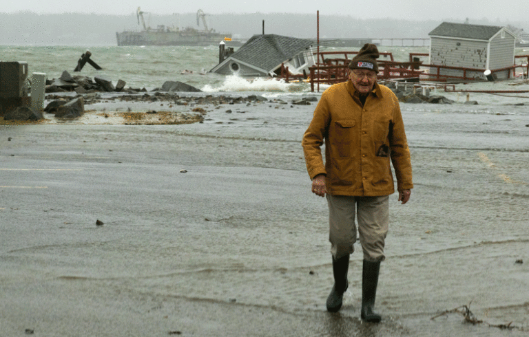A man walks away from the storm-damaged Rockland waterfront on Jan. 9. PHOTO: JACK SULLIVAN