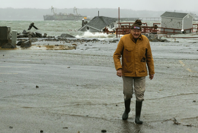 A man walks away from the storm-damaged Rockland waterfront on Jan. 9. PHOTO: JACK SULLIVAN