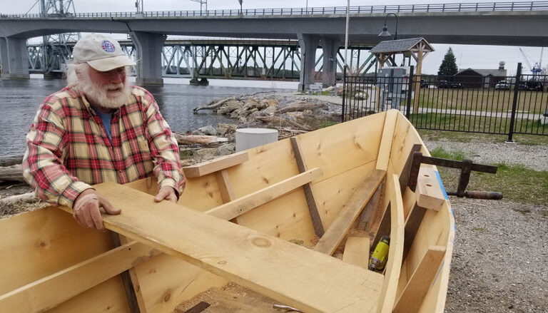 Rob Stevens works on the bateau replica.