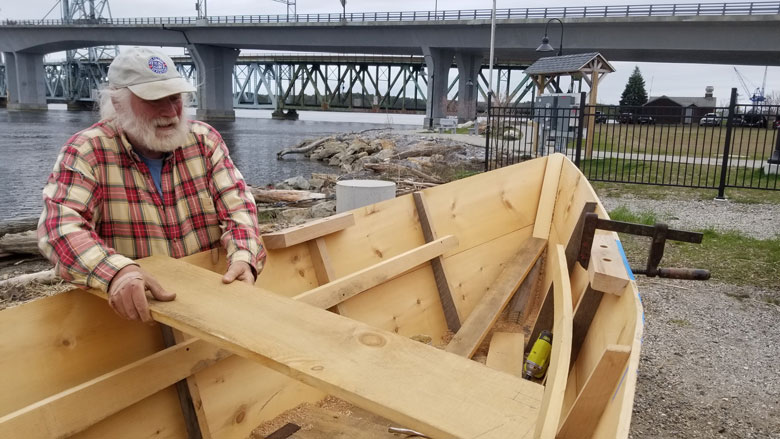 Rob Stevens works on the bateau replica.