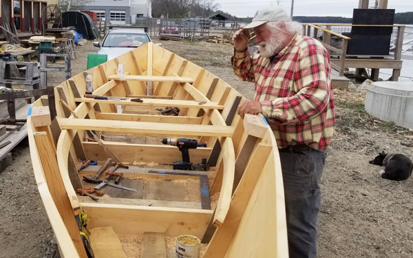 Rob Stevens finishing details on the bateau.