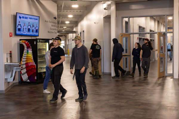 Students walk from lunch break back to class.