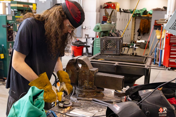 Jonathan Brown works on a project in the machine tool program.