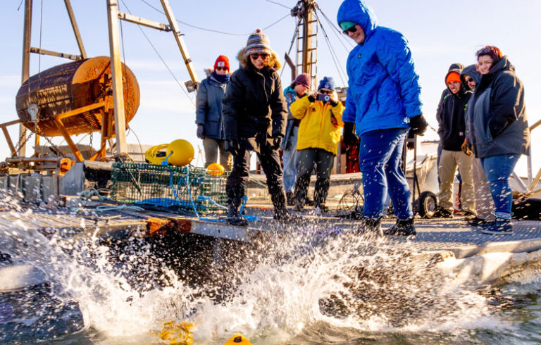Megan Shapiro, left, and Rory Morgan of Maine Department of Marine Resources deploy a ropeless lobster trap in a demonstration of some of the new technology for community leaders and fishermen at Jonesport’s town landing on Feb. 18. See the story inside for more information about the new gear. PHOTO: JACK SULLIVAN