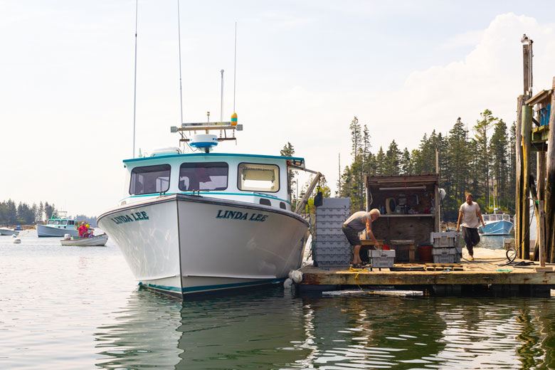 A boat unloads its catch at the Port Clyde Co-op in 2023. FILE PHOTO: JACK SULLIVAN