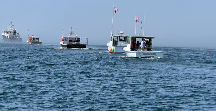 A line of boats heading to Frenchboro to mark David Lunt's passing. PHOTO: PETER RALSTON