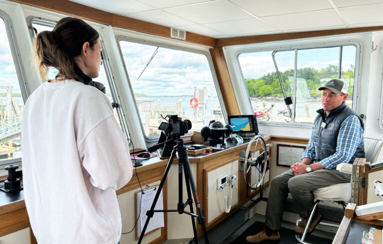 Filmmaker Laura Hamilton interviews Capt. Matt Ridgway general manager of the Chebeague Transportation Co. PHOTO: SUSAN STRANAHAN