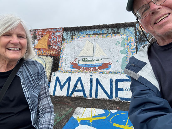 Janice Drinan and David Platt take a selfie at the wharf in Horta, Azores.
