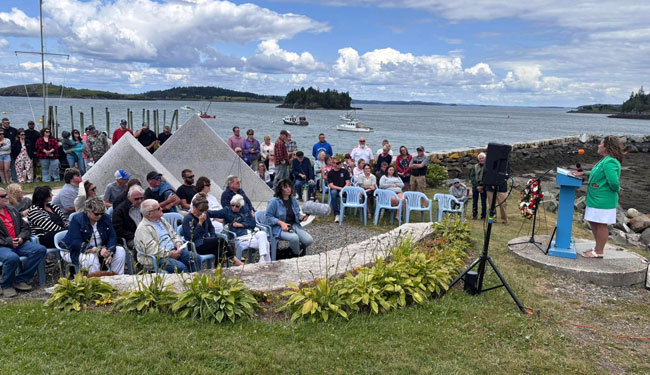 Liz Michaud speaks at the fishermen’s memorial in Lubec.